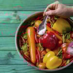 Washing vegetables in a pot of water with baking soda