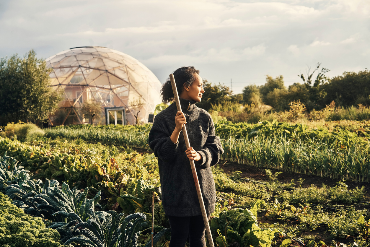 Shot of a young woman working on a farm
